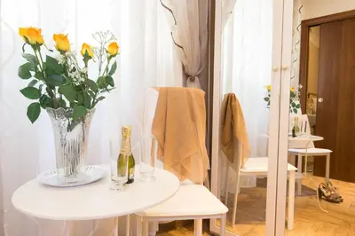 a bedroom with a large white bed and a table at Starry Rome Guest House in Rome