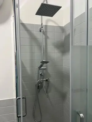 a shower with a shower head in a bathroom at AThome104 in Rome