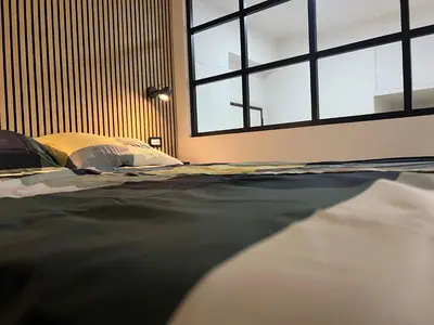 a bedroom with a bed with a large window at AThome104 in Rome