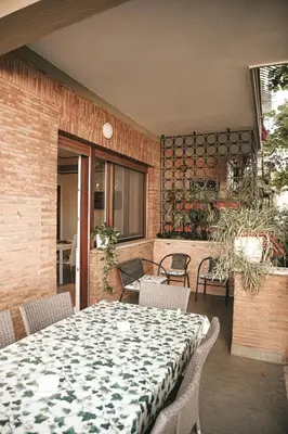 an open door to a living room with a dining room at Vatican House Apartment in Rome