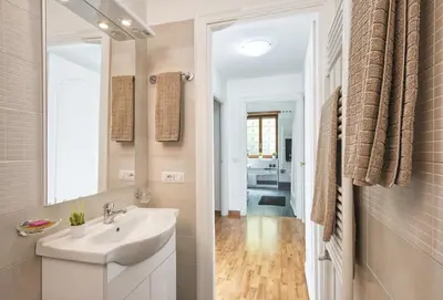 a bathroom with a sink and a mirror at Vatican House Apartment in Rome