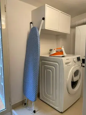 a laundry room with a washer and dryer at Elian Apartament in The Center of Rome #3 Colosseo in Rome