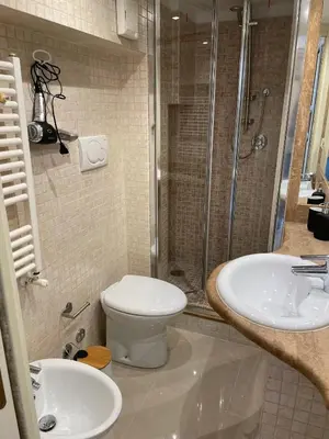 a bathroom with a shower and a toilet and a sink at Elian Apartament in The Center of Rome #3 Colosseo in Rome