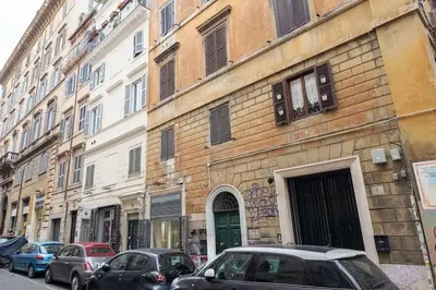 a bedroom with a bed and a bathroom with a sink at NEW! Monti 63 in Rome