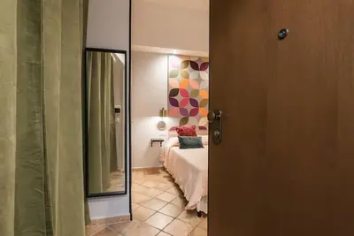 a white bathroom with a toilet and a sink at NEW! Monti 63 in Rome