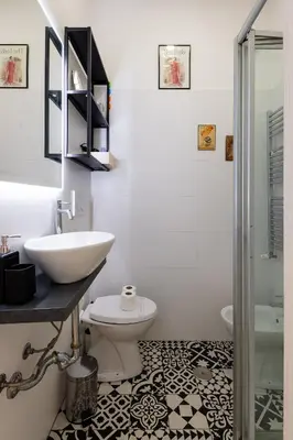 a bathroom with a sink and a toilet and a shower at La Dolce Vita - Testaccio Authentic District 2 in Rome