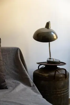 a lamp sitting on a table next to a couch at La Dolce Vita - Testaccio Authentic District 2 in Rome