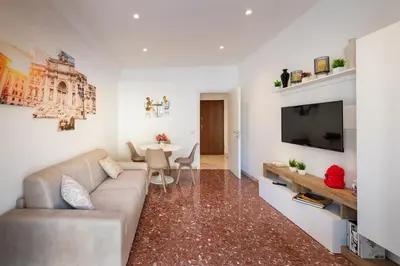 a living room with a couch and a table at Luxury and Sweet home-Metro Malatesta in Rome