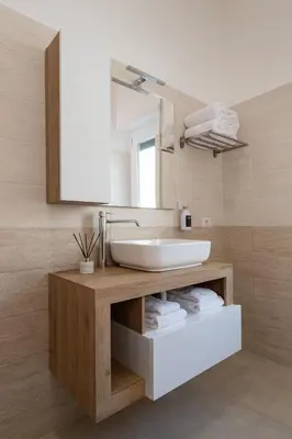 a bathroom with a sink and a mirror at Luxury and Sweet home-Metro Malatesta in Rome