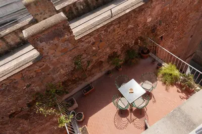 an overhead view of a patio with a table and chairs at 2 BR Flat with Vatican Terrace in Rome