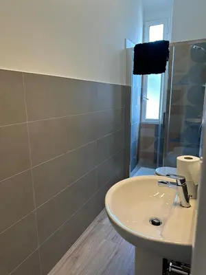 a bathroom with a sink and a shower at Lotto 10 in Rome