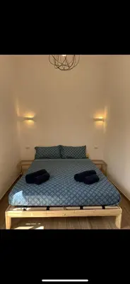 a bedroom with a bed with two pillows on it at Lotto 10 in Rome