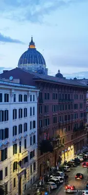 a large building with a dome on top of it at S.Pietro Elvira's retro apartment in Rome