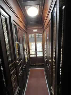 a hallway with wood paneling and a ceiling with a window at S.Pietro Elvira's retro apartment in Rome