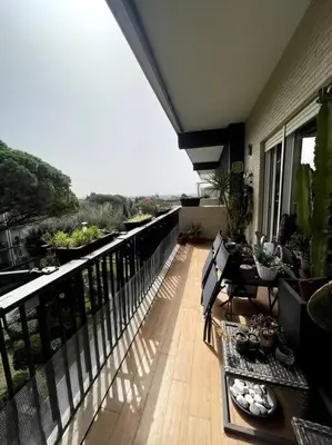 a balcony with tables and chairs on a balcony at VaticanoDreamSuite in Rome