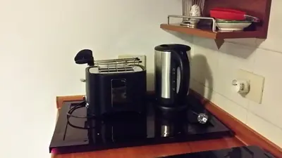 a coffee maker sitting on top of a counter at Trevispagna Charme Apartment Autonomous in Rome