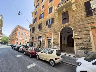 a row of cars parked on the side of a street at Trastevere Lovely 2 BR Apartment in Rome