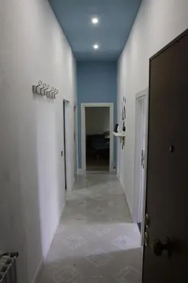 a hallway of a house with a hallway at Domus Marrana - 15 minutes far away from Coloseum in Rome