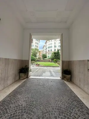 an empty hallway with an open door to a building at Stans Dolce Lusso Basilica San Giovanni in Rome
