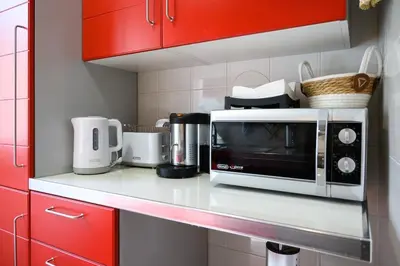 a microwave on a counter in a kitchen at vatican house in Rome