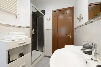 a bathroom with a toilet and a sink and a shower at vatican house in Rome
