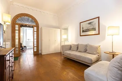 a living room with a couch and a table at Frattina Atmosphere by Rental in Rome in Rome