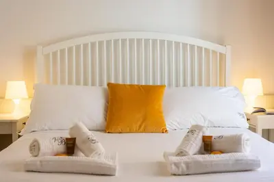 a bedroom with a bed with two towels on it at Frattina Atmosphere by Rental in Rome in Rome