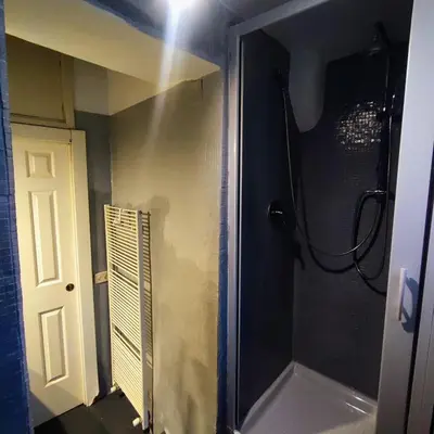 a bathroom with a shower with a glass door at 3Chic Maison Colosseo in Rome