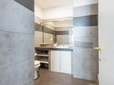 a bathroom with a toilet and a sink at Auditorium Luxury Apartments in Rome