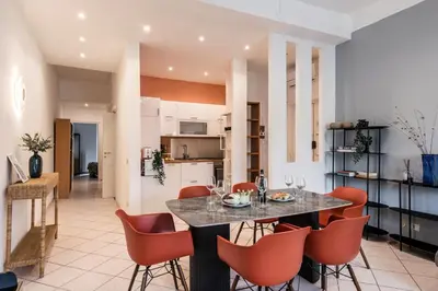 a bedroom with a bed with two side tables at The Best Rent – Bright three-bedroom apartment along the Tiber River in Rome