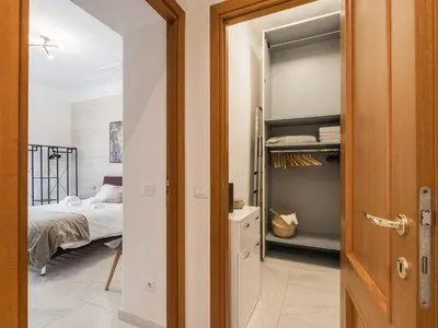 a bedroom with a bed and a closet at The Best Rent – Bright two-bedrooms apartment in Testaccio area in Rome