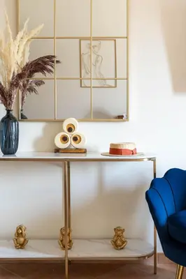 a table with a blue chair and a blue couch at RosaM Suite - Via Veneto 15 min walk from Spanish Steps Top Floor Luxury Apartment in Rome