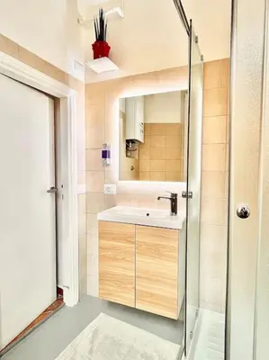 a bathroom with a sink and a mirror and a shower at Oasi di relax a Trastevere in Rome
