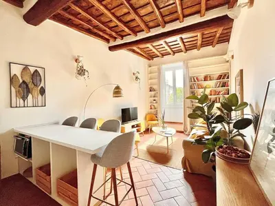 a living room with a white table and chairs at Oasi di relax a Trastevere in Rome