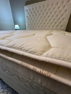 a large bed with a mattressvisorvisorvisor at Luxury room Anelli center of Roma in Rome