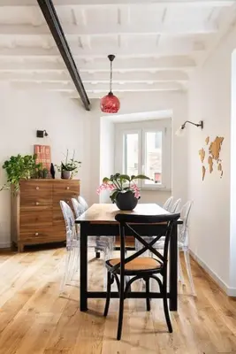 a dining room with a table and chairs at Idyllia - Cozy central retreat in Trastevere in Rome