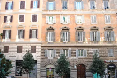 an old building in the city with a bunch of windows at Lombardo in Rome