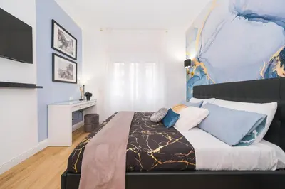 a bedroom with a king sized bed in a room at The blue Iris in Rome