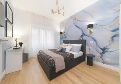 a bedroom with a bed and a large mural at The blue Iris in Rome