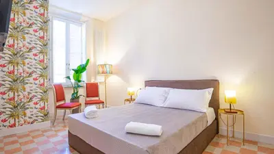 a bedroom with a bed with two towels on it at Sibylla in Rome in Rome