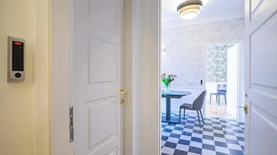 a door leading into a dining room with a table at Sibylla in Rome in Rome
