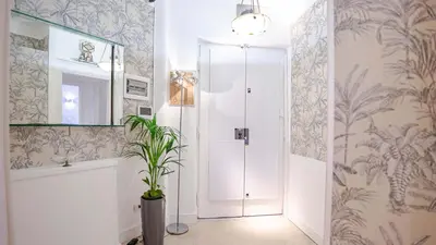 a bathroom with a shower and a potted plant at Sibylla in Rome in Rome