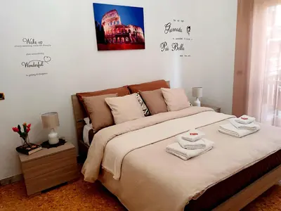 a bedroom with a bed with towels on it at casa Aldini in Rome