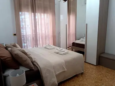 a bedroom with a large bed with towels on it at casa Aldini in Rome