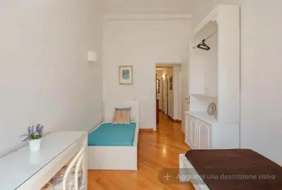a living room with a couch and a table at SAN PIETRO VATICAN AREA LARGE APARTMENT - near SUBWAY in Rome