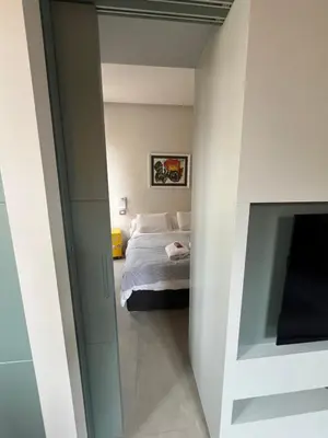 a bedroom with a bed and a television at CARPE DIEM Ponte Milvio Olimpico Farnesina in Rome
