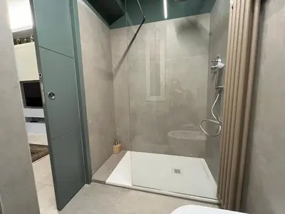 a bathroom with a glass shower with a toilet at CARPE DIEM Ponte Milvio Olimpico Farnesina in Rome