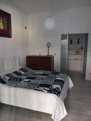 a kitchen with a sink and a rug on the floor at Salotto Sommer San Pietro in Rome