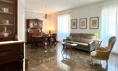 a living room with a couch and a table at 4BNB - Leone IV Apartment in Rome