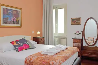 a bedroom with a bed with towels on it at 4BNB - Leone IV Apartment in Rome